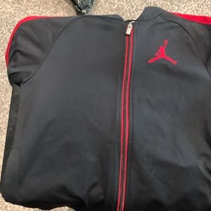 Air Jordan jacket (1), short sleeve shirts (2,4), long sleeve shirts (3)